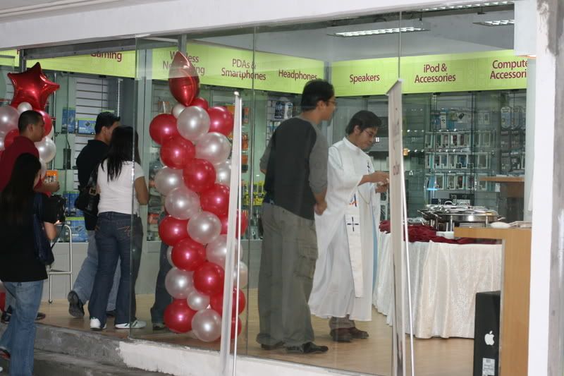 The priest blesses the store