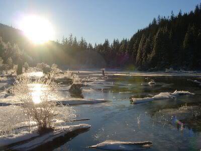 Sunrise over frozen Buntzen Lake